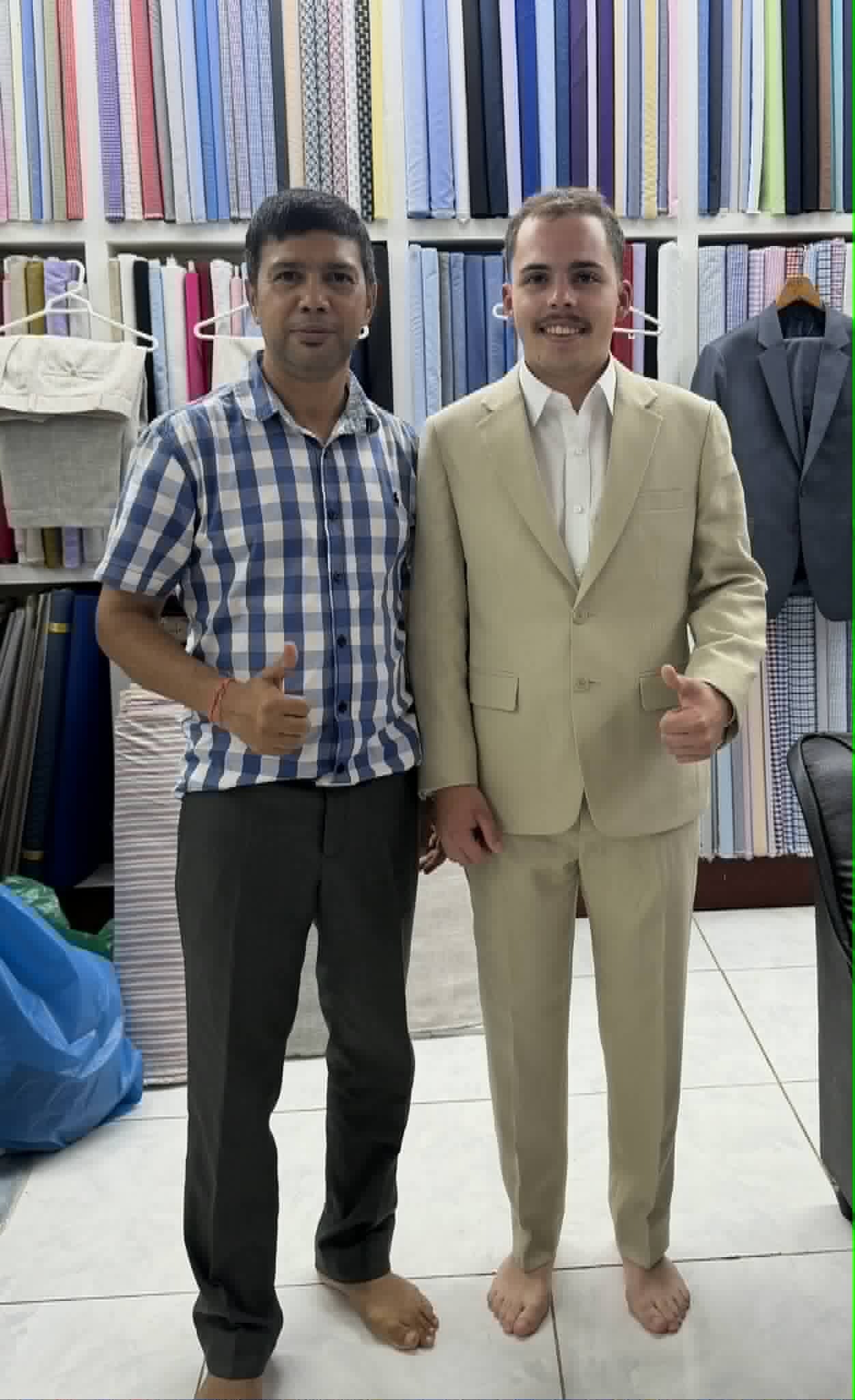 Tailor with satisfied customer